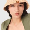 Cappello a secchiello in rafia lavorato all’uncinetto