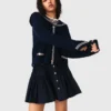 Cardigan con collo a barchetta e lavorazione a trecce
