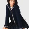Cardigan con collo a barchetta e lavorazione a trecce