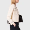 Cardigan corto con impunture