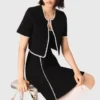 Cardigan corto con impunture Cardigan corto con impunture