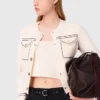 Cardigan corto con impunture