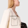 Cardigan corto con impunture