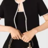 Cardigan corto con impunture Cardigan corto con impunture