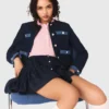 Giacca in tweed con bordi in denim Giacca in tweed con bordi in denim