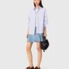 Gonna corta in denim a pieghe con strass Gonna corta in denim a pieghe con strass