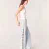 Jeans a zampa con strappi e strass Jeans a zampa con strappi e strass