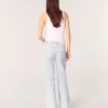 Jeans a zampa con strappi e strass Jeans a zampa con strappi e strass