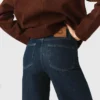 Jeans a zampa con tasche applicate Jeans a zampa con tasche applicate
