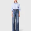 Jeans in denim a gamba larga con borchie Jeans in denim a gamba larga con borchie