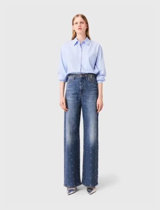 Jeans in denim a gamba larga con borchie Jeans in denim a gamba larga con borchie