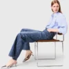 Jeans in denim a gamba larga con borchie Jeans in denim a gamba larga con borchie