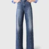 Jeans in denim a gamba larga con borchie Jeans in denim a gamba larga con borchie