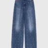 Jeans in denim a gamba larga con borchie Jeans in denim a gamba larga con borchie