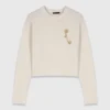 Maglione con spilla floreale Maglione con spilla floreale