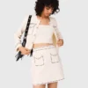 Mini gonna in maglia con impunture Mini gonna in maglia con impunture
