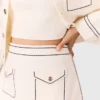 Mini gonna in maglia con impunture Mini gonna in maglia con impunture