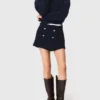 Pantaloncini in tweed con cintura a contrasto