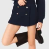 Pantaloncini in tweed con cintura a contrasto