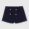 Pantaloncini in tweed con cintura a contrasto