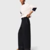 Pantaloni in cotone con cintura in pelle Pantaloni in cotone con cintura in pelle