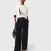 Pantaloni in cotone con cintura in pelle Pantaloni in cotone con cintura in pelle