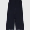 Pantaloni in cotone con cintura in pelle Pantaloni in cotone con cintura in pelle