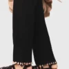 Pantaloni in maglia con gioielli