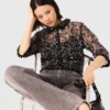 Top con paillettes floreali