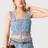Top in cotone smockato con strass Top in cotone smockato con strass