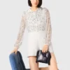 Tuta in tweed con paillettes