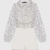 Tuta in tweed con paillettes