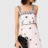 Vestito lungo con cut-out ricamati